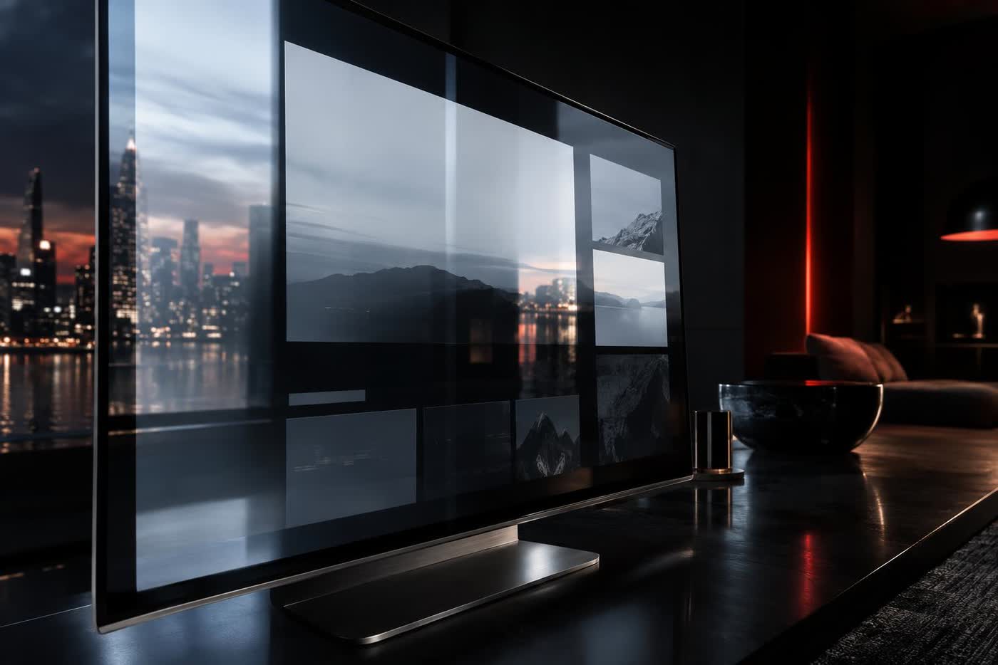 A large screen at an oblique angle in a dark room, its glossy surface catching a hard reflection so the clean layout on it is almost impossible to make out.